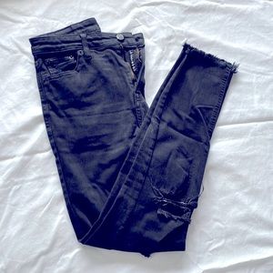 Lucky Brand black skinny jeans with holes in the knee